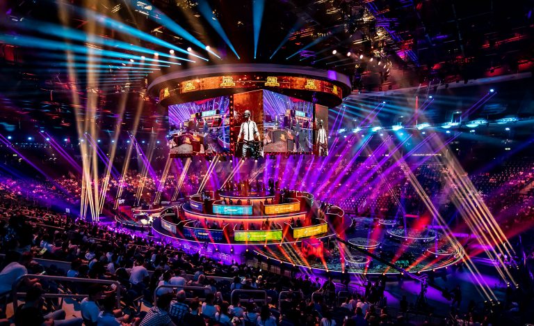 Live Legends eSports event with a vibrant stage and audience.