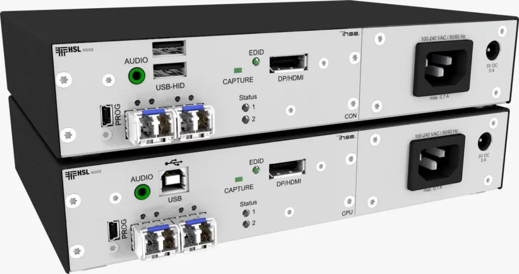 The image showcases The Draco vario KVMA Isolated Secure Extenders, featuring a standalone console with two boxes. Its outer part is sleek black, while the front section, housing all the USB ports and connectors, is silver.