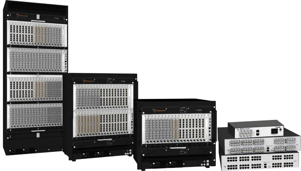 The image presents the Draco KVM Matrix range, displaying multiple units. The exterior is a sleek black, while the front section, which houses all the USB ports and connectors, is silver in color.